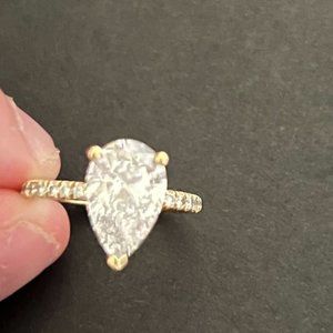 2.53 Carat Ring. Pear Shape with 18k Gold Band with diamond hidden halo